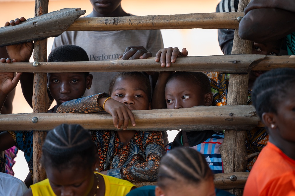 U.S. Army soldiers with the 91st Civil Affairs Battalion deployed with Special Operations Command Africa, conduct a civil engagement with Forces des Armées Beninoises members