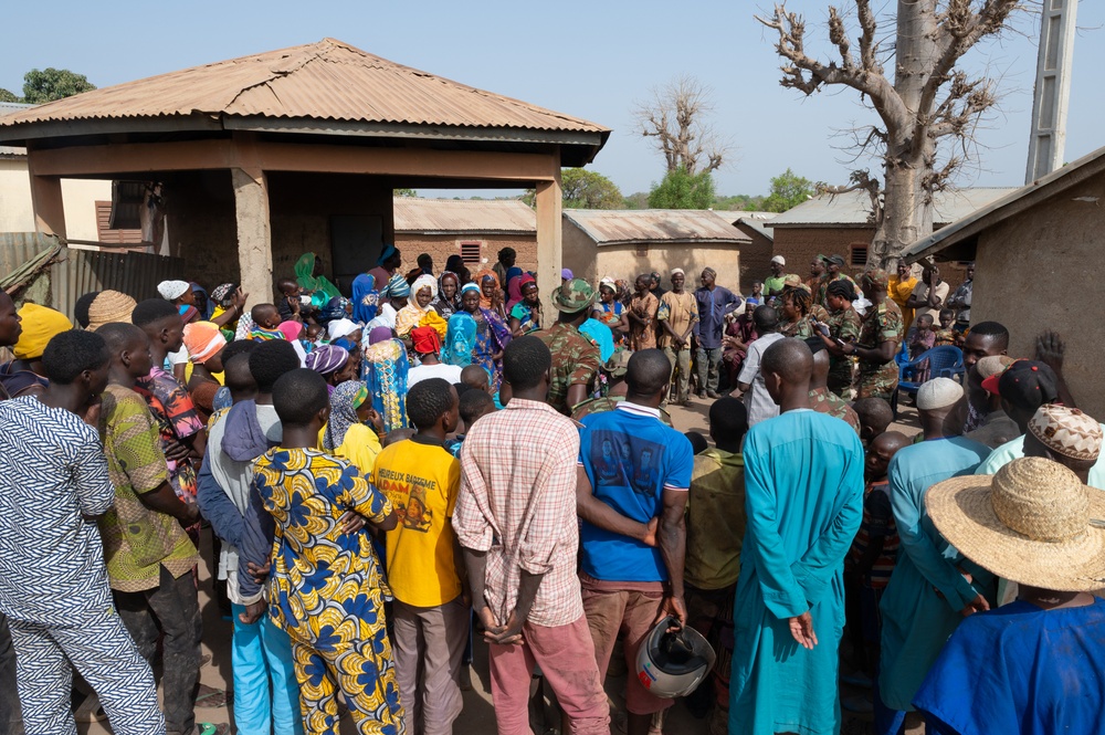 U.S. Army soldiers with the 91st Civil Affairs Battalion deployed with Special Operations Command Africa, conduct a civil engagement with Forces des Armées Beninoises members