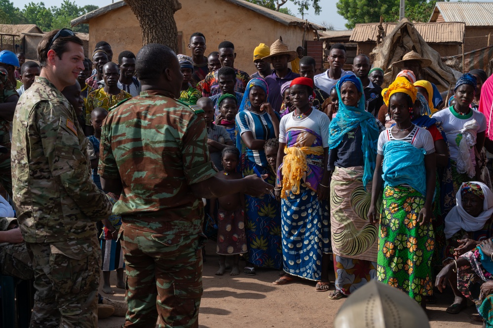 U.S. Army soldiers with the 91st Civil Affairs Battalion deployed with Special Operations Command Africa, conduct a civil engagement with Forces des Armées Beninoises members