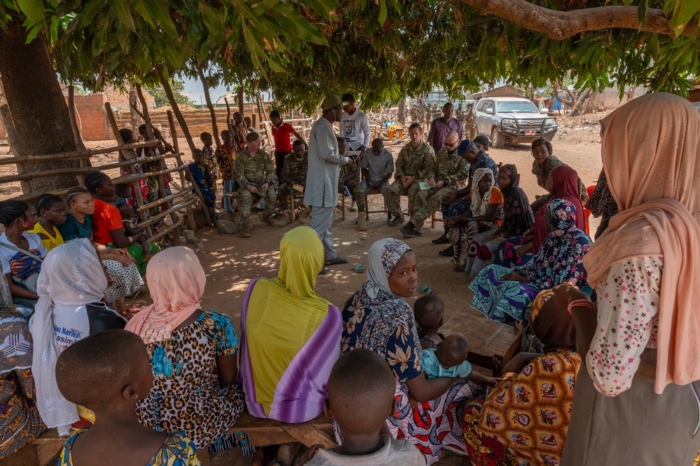 U.S. Army soldiers with the 91st Civil Affairs Battalion deployed with Special Operations Command Africa, conduct a civil engagement with Forces des Armées Beninoises members