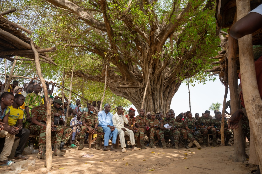 U.S. Army soldiers with the 91st Civil Affairs Battalion deployed with Special Operations Command Africa, conduct a civil engagement with Forces des Armées Beninoises members