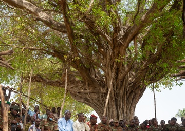 U.S. Army soldiers with the 91st Civil Affairs Battalion deployed with Special Operations Command Africa, conduct a civil engagement with Forces des Armées Beninoises members