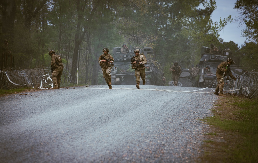 Armored units support infantry at the Joint Readiness Training Center