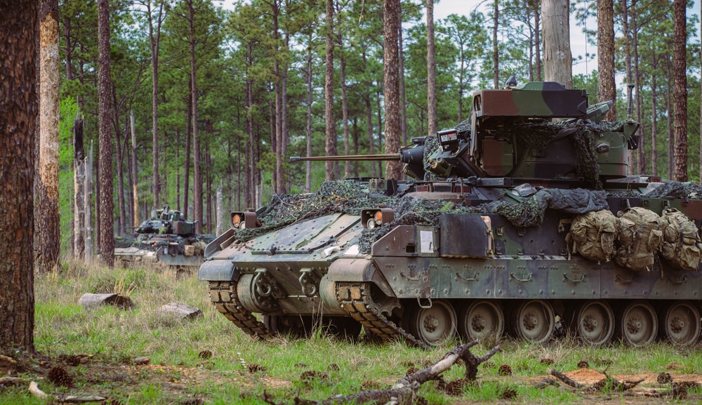 Armored units support infantry at the Joint Readiness Training Center