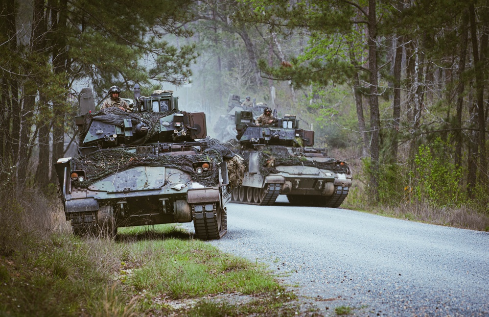 Armored units support infantry at the Joint Readiness Training Center