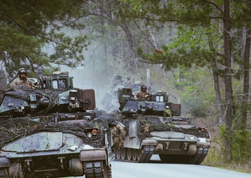 Armored units support infantry at the Joint Readiness Training Center