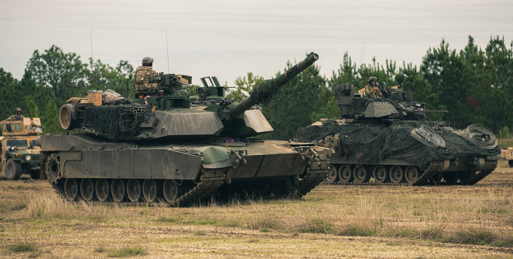 Armored units support infantry at the Joint Readiness Training Center