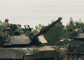 Armored units support infantry at the Joint Readiness Training Center