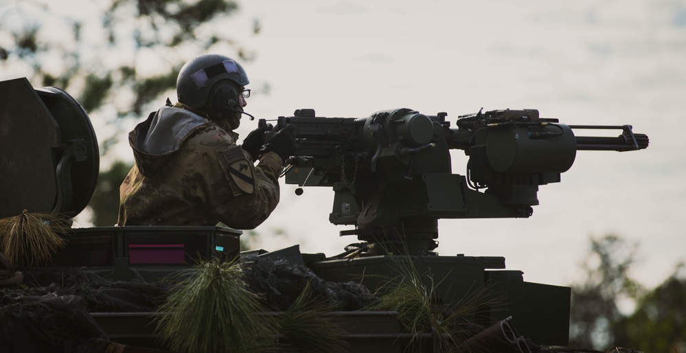 Armored units support infantry at the Joint Readiness Training Center