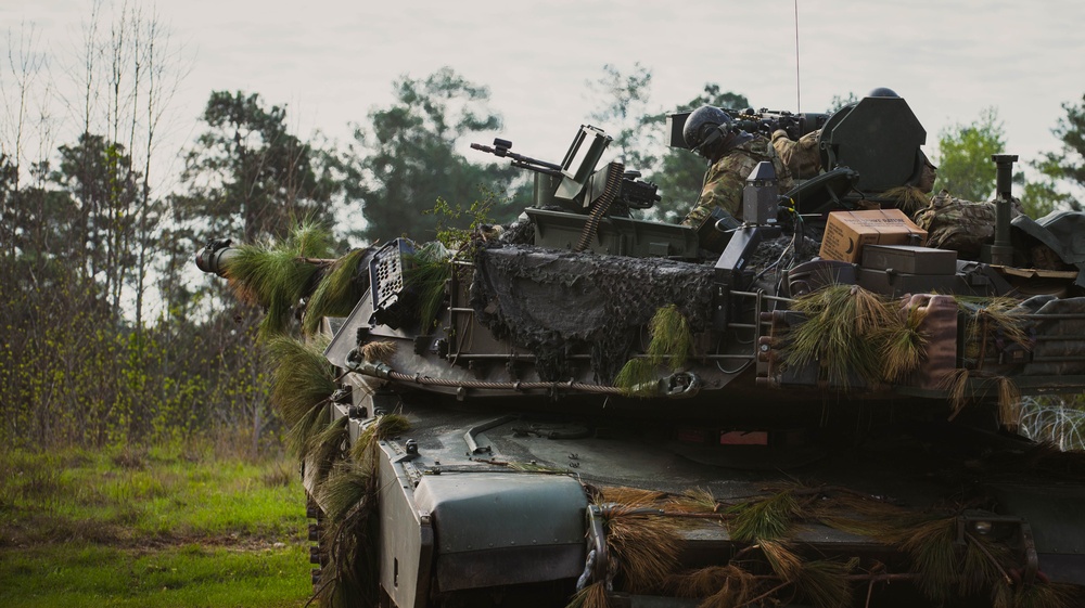 Armored units support infantry at the Joint Readiness Training Center