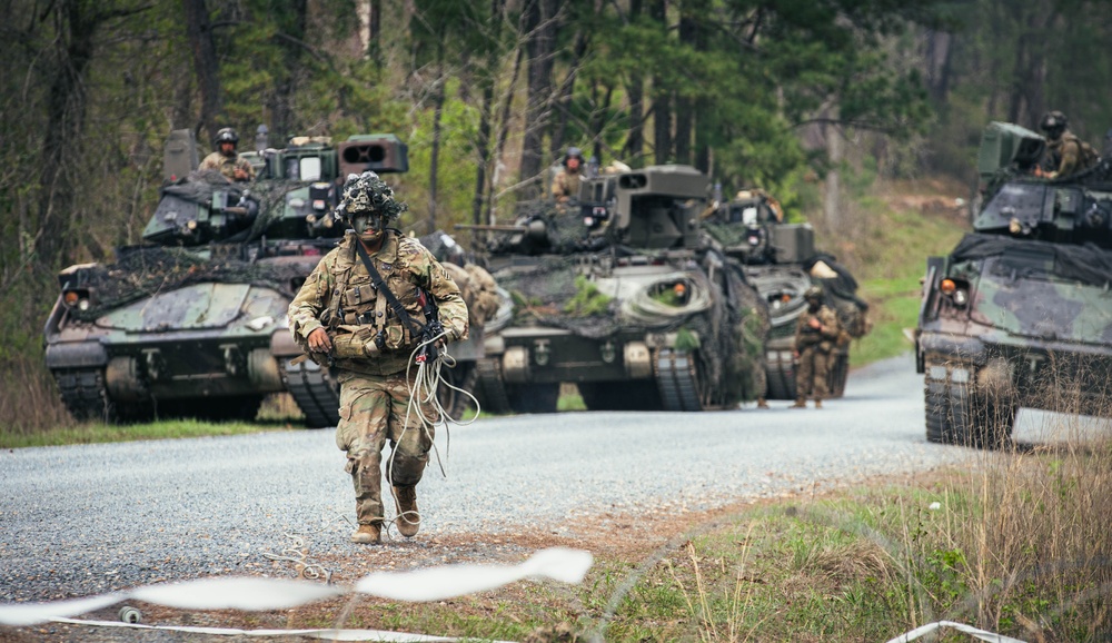 Armored units support infantry at the Joint Readiness Training Center