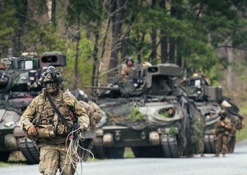 Armored units support infantry at the Joint Readiness Training Center