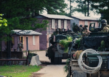 Armored units support infantry at the Joint Readiness Training Center