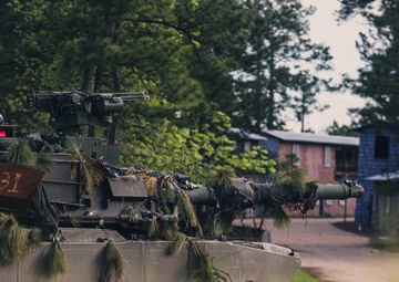 Armored units support infantry at the Joint Readiness Training Center