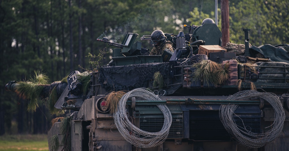 Armored units support infantry at the Joint Readiness Training Center