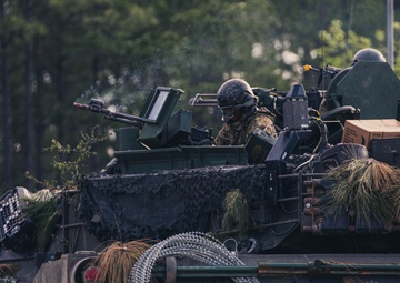 Armored units support infantry at the Joint Readiness Training Center