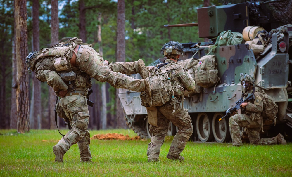 Armored units support infantry at the Joint Readiness Training Center