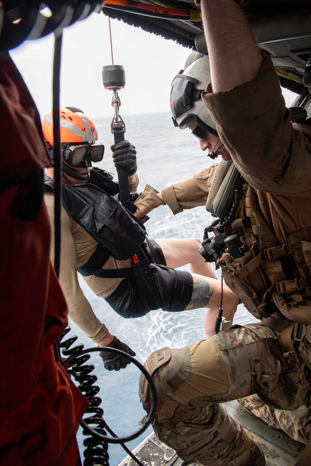 Naval Aircrewmen (Helicopter) Participate in a Live-Hoisting Exercise in the Red Sea