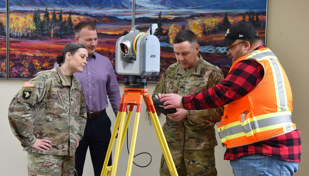 Alaska District's Geomatics Section presents surveying equipment to staff during National Surveyors Week