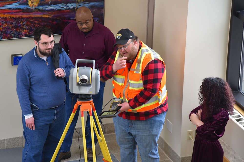 Alaska District staff learn about surveying equipment during National Surveyors Week