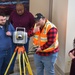 Alaska District staff learn about surveying equipment during National Surveyors Week