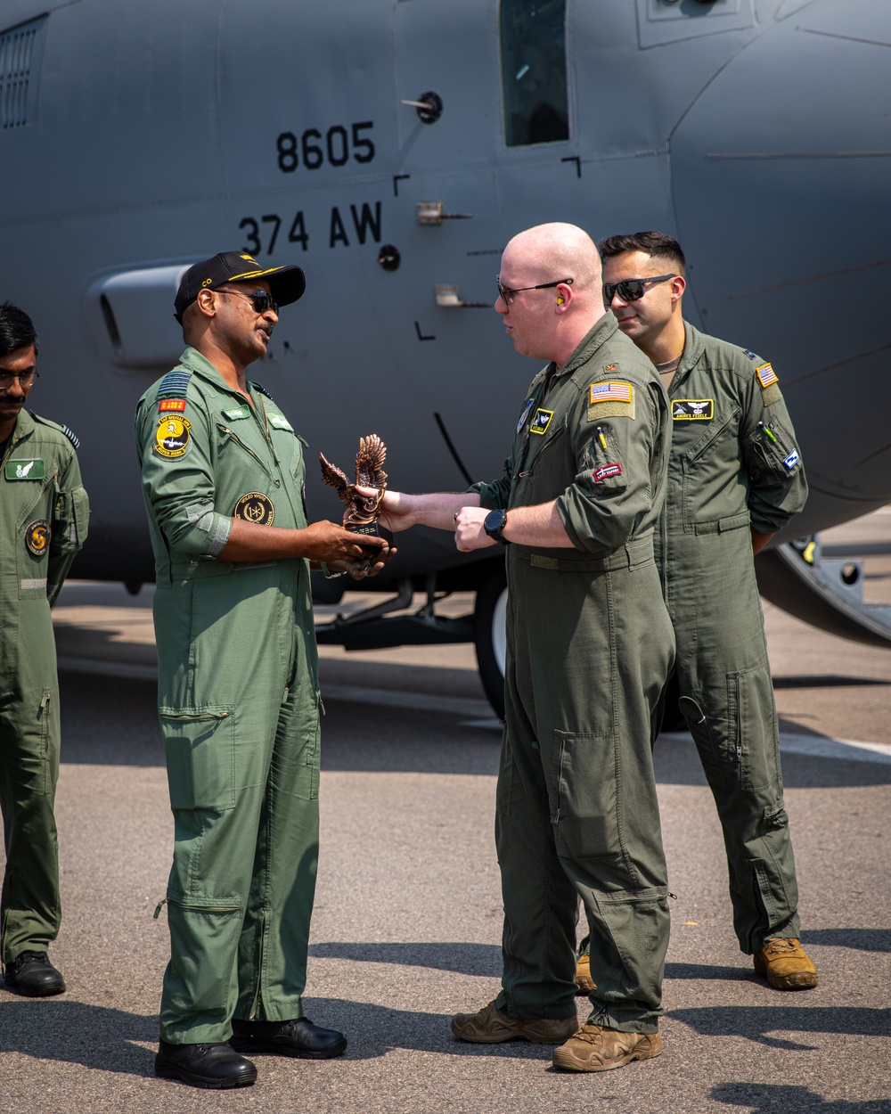 U.S. and Indian Airmen exchange gifts during Exercise Tiger TRIUMPH