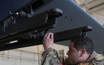 Precision Training in Action: Crew Equips MQ-9 Reaper with Mock Munitions