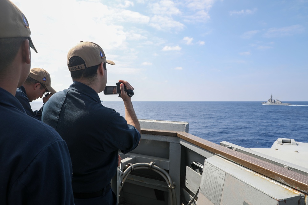 Sailors Aboard The USS Howard Stand Watch During a Surface Warfare Exercise