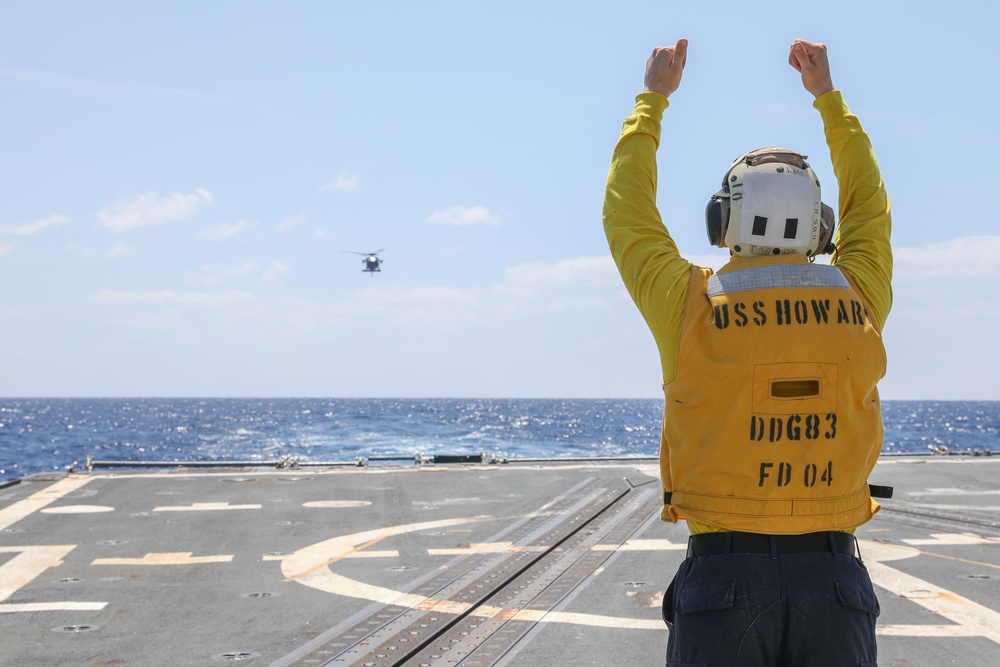 Sailors Aboard The USS Howard Conduct Flight Quarters in the Philippine Sea