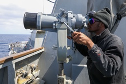 Sailors Aboard The USS Howard Stand Watch on the Bridge Wing During an Air Defense Exercise in the Philippine Sea