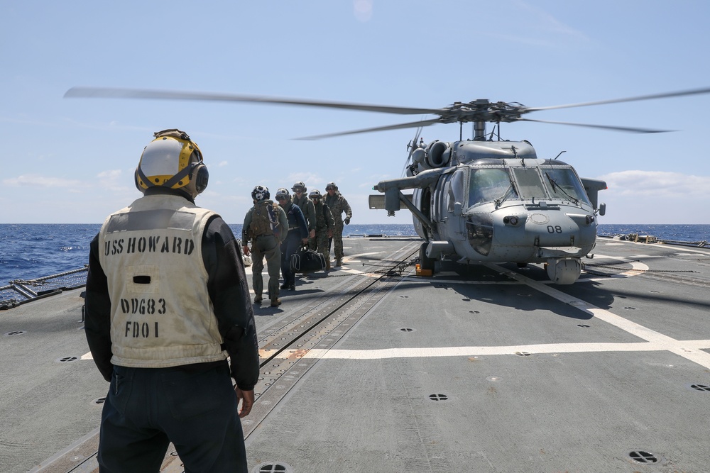Sailors Aboard The USS Howard Welcome Col. Matthew Danner, Commanding Officer of the 3rd Marine Expeditionary Unit, and Other Officers on the Ship's Flight Deck in the Philippine Sea