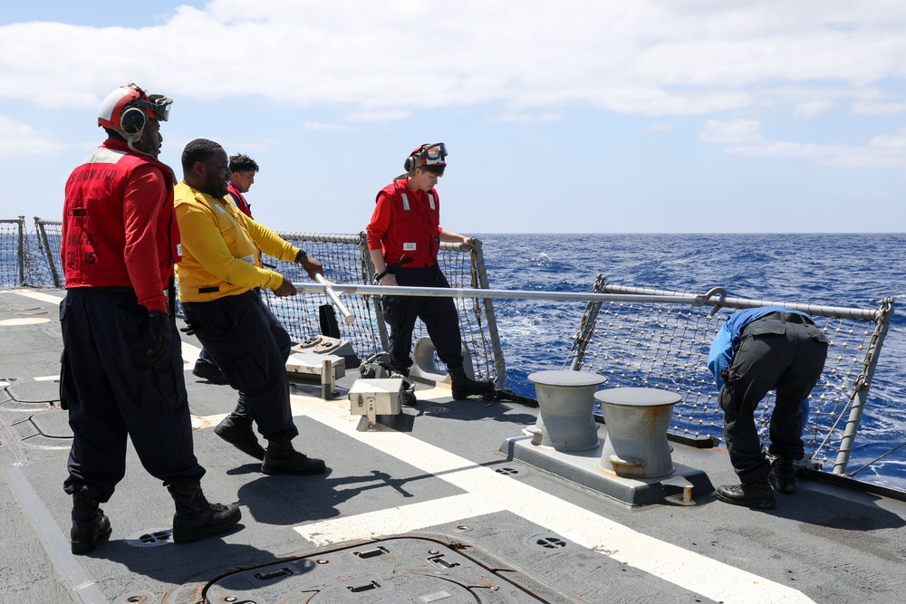 Sailors Aboard The USS Howard Prepare for Flight Quarters on the Flight Deck in the Philippine Sea