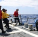 Sailors Aboard The USS Howard Prepare for Flight Quarters on the Flight Deck in the Philippine Sea