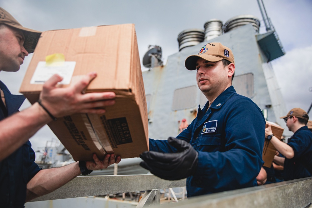 Sailors participate in an all-hands working party