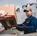 Sailors participate in an all-hands working party