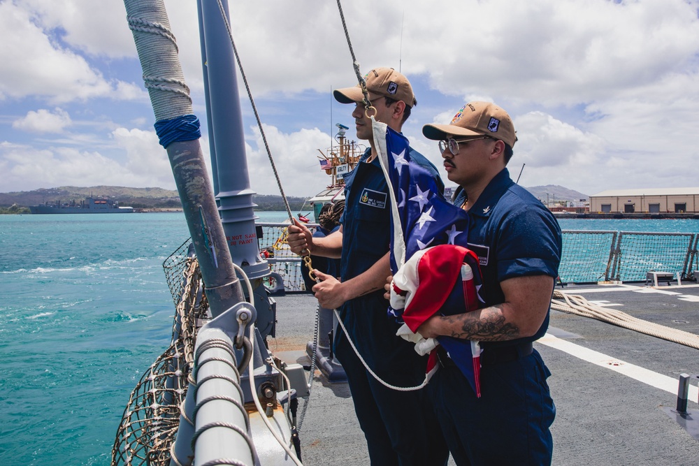 USS John S McCain Sailors prepare to shift colors