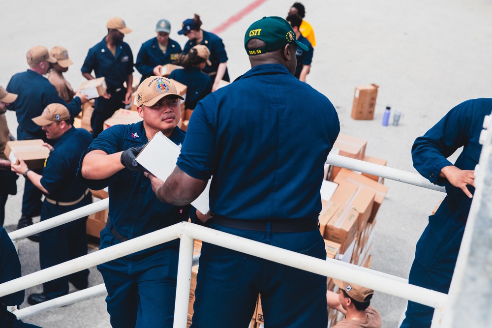 Sailors participate in an all-hands working party