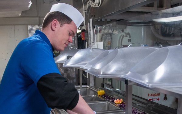 USS Ronald Reagan (CVN 76) Sailors prepare food in a galley