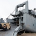 DoD, contracted personnel load hundreds of U.S. Army equipment aboard USNS Charlton