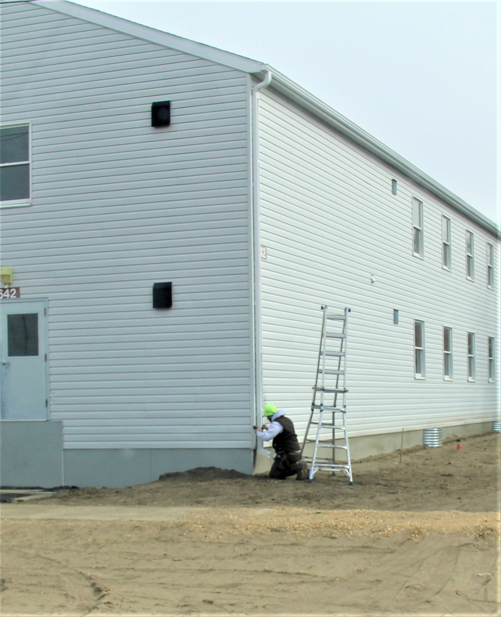 Reset of World War II-era barracks moved in 2023 continues; work nearly complete