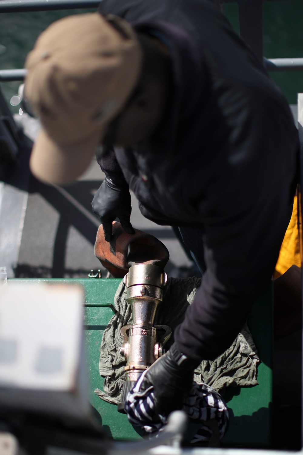 USS Tripoli Sailors Perform Flight Deck Maintenance