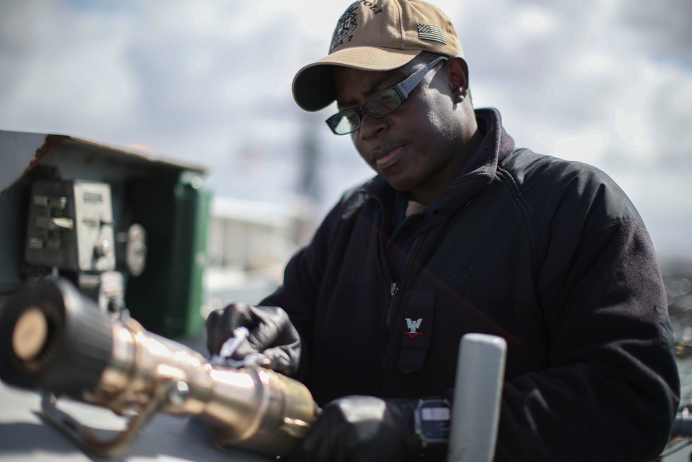 USS Tripoli Sailors Perform Flight Deck Maintenance