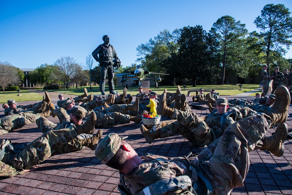 Officer trainees exercise in front of Karl Richter Memorial