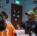 Theodore Roosevelt Sailors Conduct COMRELs in Singapore