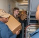 Sailors aboard the USS Howard conduct a replenishment-at-sea with USNS Yukon in the Philippine Sea