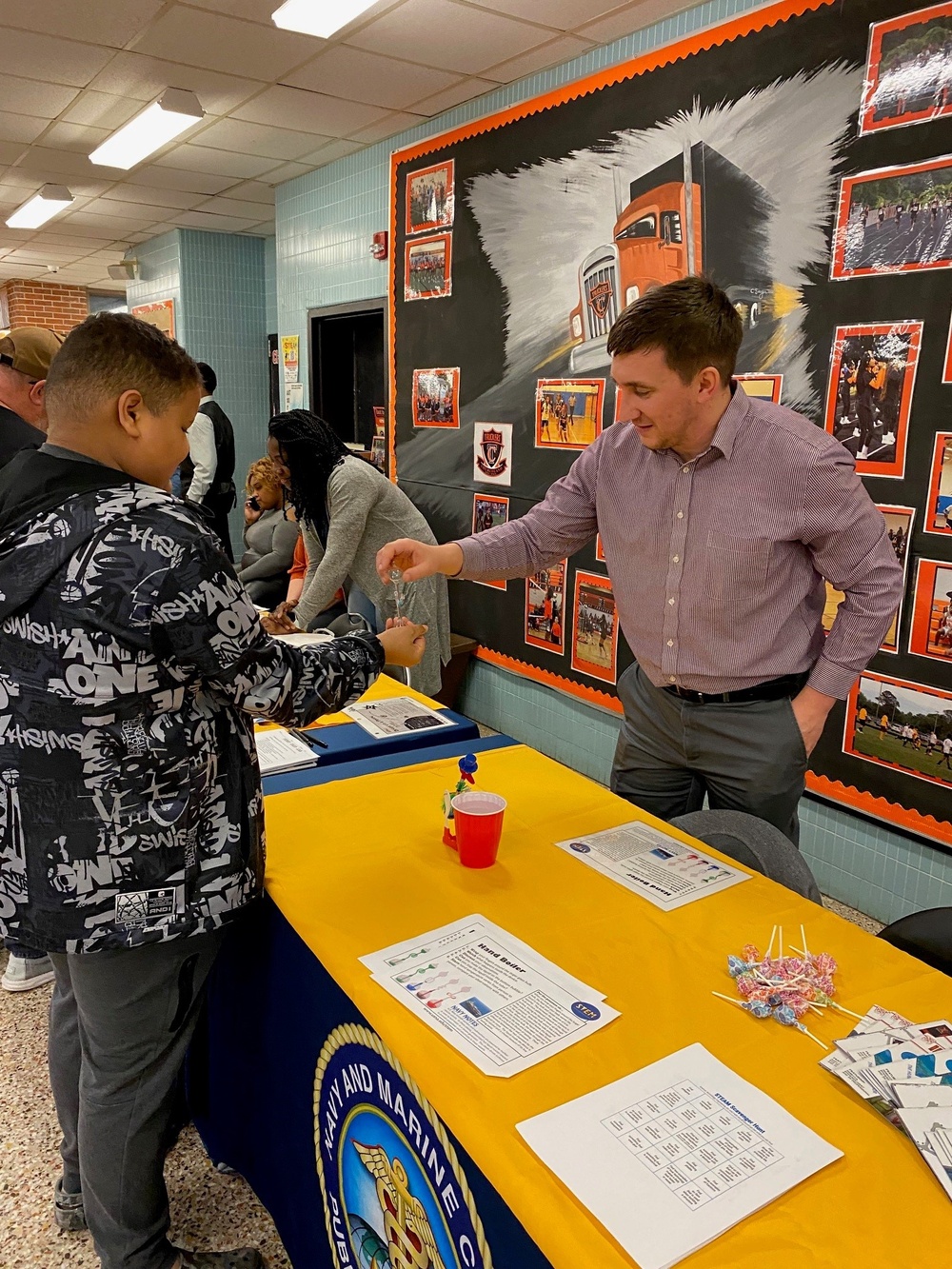 Charting a Course for Public Health: Navy and Marine Corps Force Health Protection Command Volunteers Lead the Way at Portsmouth Middle School STEAM Expo