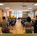 Graduation: Volunteers from Marine Corps Air Station Iwakuni hand out graduation certificates