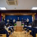 Graduation: Volunteers from Marine Corps Air Station Iwakuni hand out graduation certificates