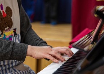 Graduation: Volunteers from Marine Corps Air Station Iwakuni hand out graduation certificates