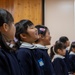 Graduation: Volunteers from Marine Corps Air Station Iwakuni hand out graduation certificates